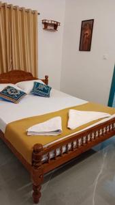 Guestland Homestay में एक कमरे में एक या कई बेड