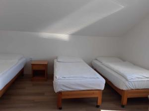 A bed or beds in a room at Apartmánový dům TERKA