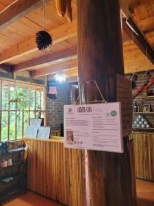 a sign on a wooden pole in a restaurant at Sapa's soul hillside in Sa Pa