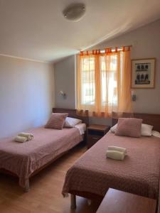 Voodi või voodid majutusasutuse Apartments & Rooms Krecak Sibenik toas