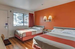 a hotel room with two beds and a window at Park Inn by Radisson, Fort Collins in Fort Collins