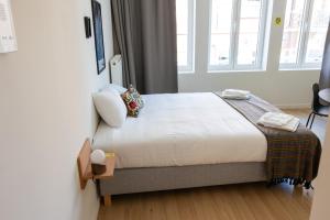 Giường trong phòng chung tại Smartflats - Leuven Central