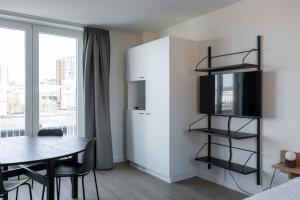 Giường trong phòng chung tại Smartflats - Leuven Central