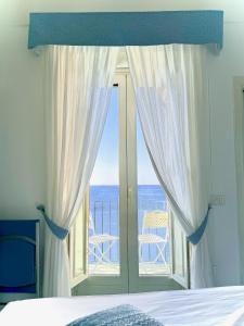 Cama ou camas em um quarto em La Clarissa Amalfi Dreams