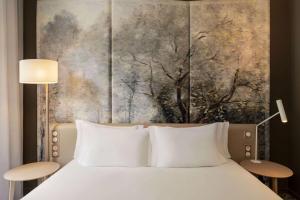 Cama ou camas em um quarto em Dolce by Wyndham Versailles - Domaine du Montcel