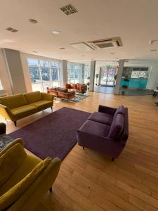 a large living room with couches and a rug at Citilodge Wakefield Hotel by Roomsbooked in Wakefield