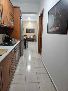 A kitchen or kitchenette at Spartan Townhouse Apt 3 Leonidas