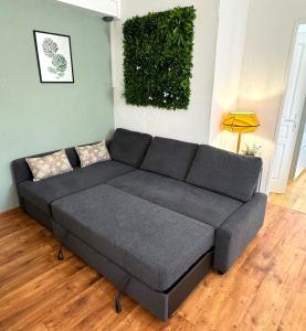 a gray couch in a living room at Résidence Sainte Cécile in Thionville