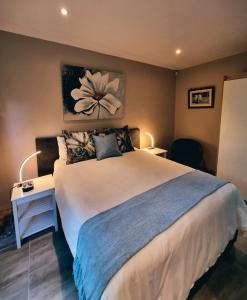 A bed or beds in a room at Cycad Place Midrand Guesthouse and B&B