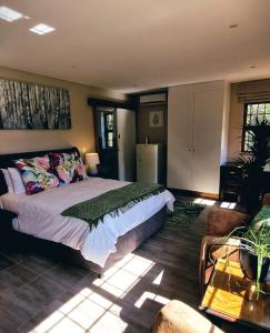 A bed or beds in a room at Cycad Place Midrand Guesthouse and B&B