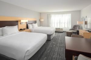 Tempat tidur dalam kamar di TownePlace Suites by Marriott Wareham Buzzards Bay