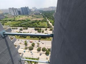 a view of a park from a tall building at Aarohi studio hotels in Noida