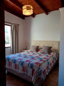 Una cama o camas en una habitación de Entre Montañas