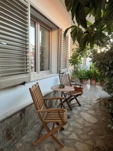 two chairs and a table on a patio at Da Gio in Olbia