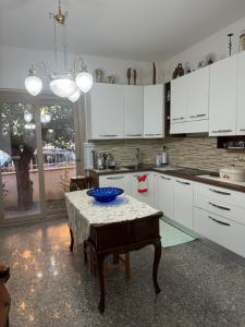 a kitchen with a table with a blue bowl on it at Da Gio in Olbia