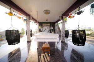 ระเบียงหรือลานระเบียงของ Aman Homestay, A Boutique Hotel