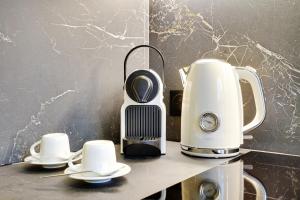 Coffee and tea making facilities at Charming Apartment by Les Maisons de Charloc Homes