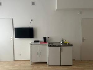 Кухня или мини-кухня в Linz City Appartements 24H Check-In
