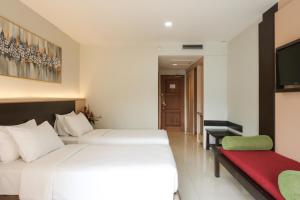 Tempat tidur dalam kamar di The Grand Hill Resort-Hotel