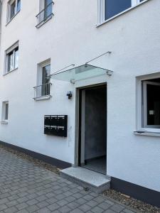 a white building with a door on the side of it at Fewo Altes Rathaus in Bamberg