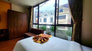 เตียงในห้องที่ New Sun Hotel Sapa