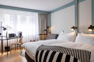 Cama ou camas em um quarto em Hotel Luzernerhof