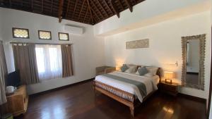 djabu Canggu Beach Villa में एक कमरे में एक या कई बेड