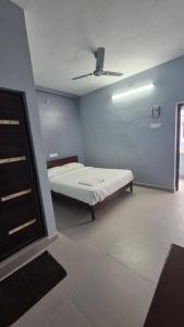 A bed or beds in a room at MJ Residency