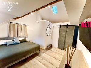 a bedroom with a bed in a room at Godi's House in Vianden