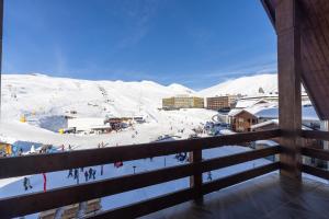 a view of a ski resort in the snow at PENTHOUSE BY GONDOLA 50 Meters, New Gudauri Suites in Gudauri