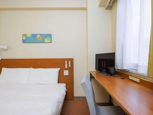 En TV eller et underholdningssystem på Comfort Inn Sano Fujioka Inter