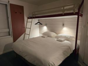 Säng eller sängar i ett rum på Stay Inn poitiers