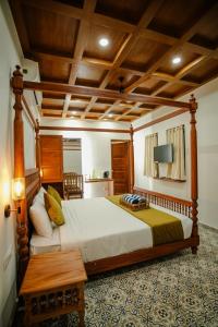 Cama ou camas em um quarto em Alleppey Haven Beach Villa