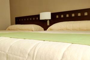 Katil atau katil-katil dalam bilik di Days Inn & Suites by Wyndham La Plata