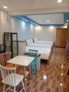 Tempat tidur dalam kamar di Anh Trang Homestay