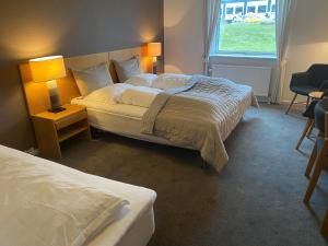 Llit o llits en una habitació de Møn Golf Resort - Hotel Præstekilde