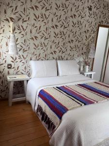 Cama ou camas em um quarto em Hotel Boutique Casa&Alma