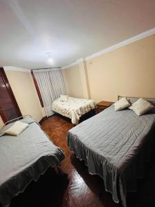 Giường trong phòng chung tại Hostel Buen descanso