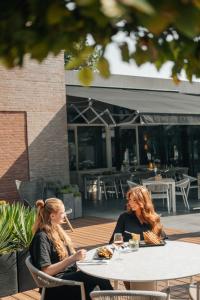 Un restaurant u otro lugar para comer en Hotel de Naaldhof