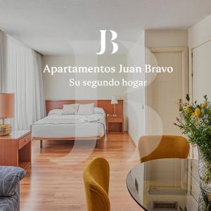 A bed or beds in a room at Apartamentos Juan Bravo