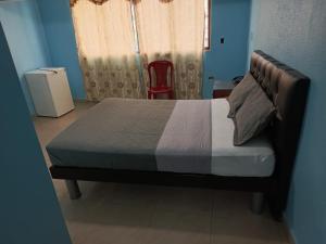 Tempat tidur dalam kamar di Hotel Caribe