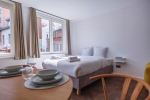 Tempat tidur dalam kamar di Märch - Leuven Diestse 26