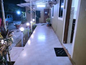 an empty hallway of a building at night at Colva beach Xaviers Guest House in Colva