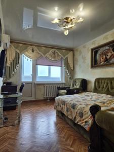 Tempat tidur dalam kamar di Центр 6-я слободская Центральный проспект