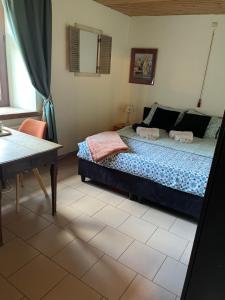 A bed or beds in a room at B&B Forêt d'Animaux