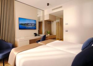 Katil atau katil-katil dalam bilik di Hotel Riviera - Terme & Wellness Lifeclass