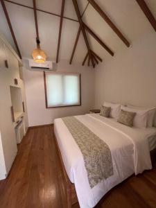 Ліжко або ліжка в номері Tropik Resort Lombok