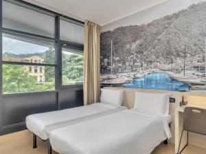 Krevet ili kreveti u jedinici u objektu B&B Hotel Como Camerlata