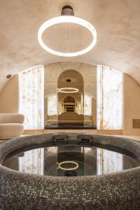 a living room with a large pool in the middle at Hôtel Singulier Bordeaux - Boutique Hôtel & Spa Anne Semonin in Bordeaux