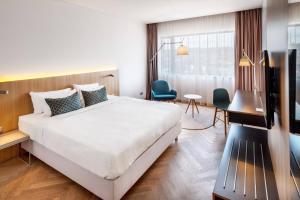 Tempat tidur dalam kamar di Courtyard by Marriott Brno